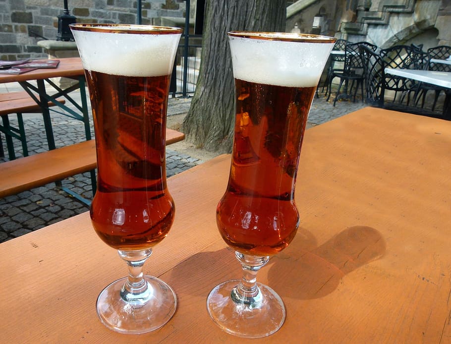 two, clear, glass footed cups, red, liquid, table, glasses, beer, beer glasses, beer garden