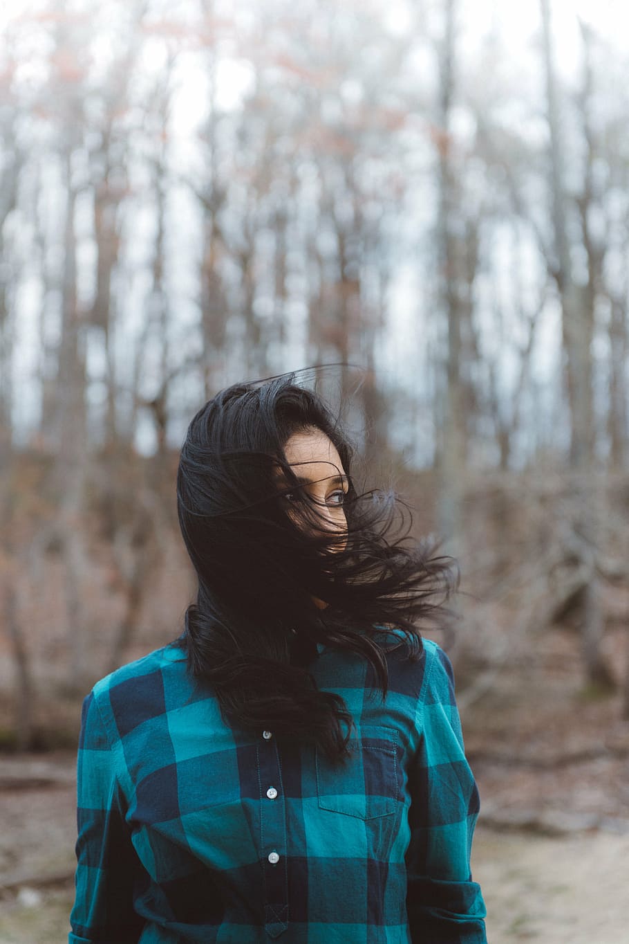 woman, wearing, teal, blue, flannel shirt, windy, day, people, girl, trees
