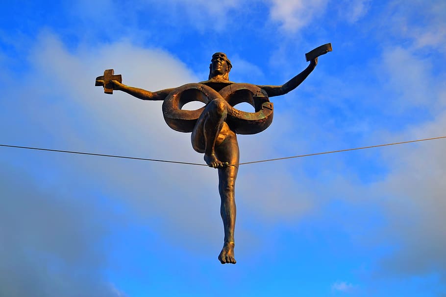 olsztyn, wheel, czestochowa, sculpture george curl, sky, low angle view, blue, cloud - sky, balance, full length