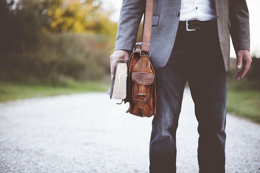 man, bag, holding, book, fashion, pants, satchel, street, walk, outdoors