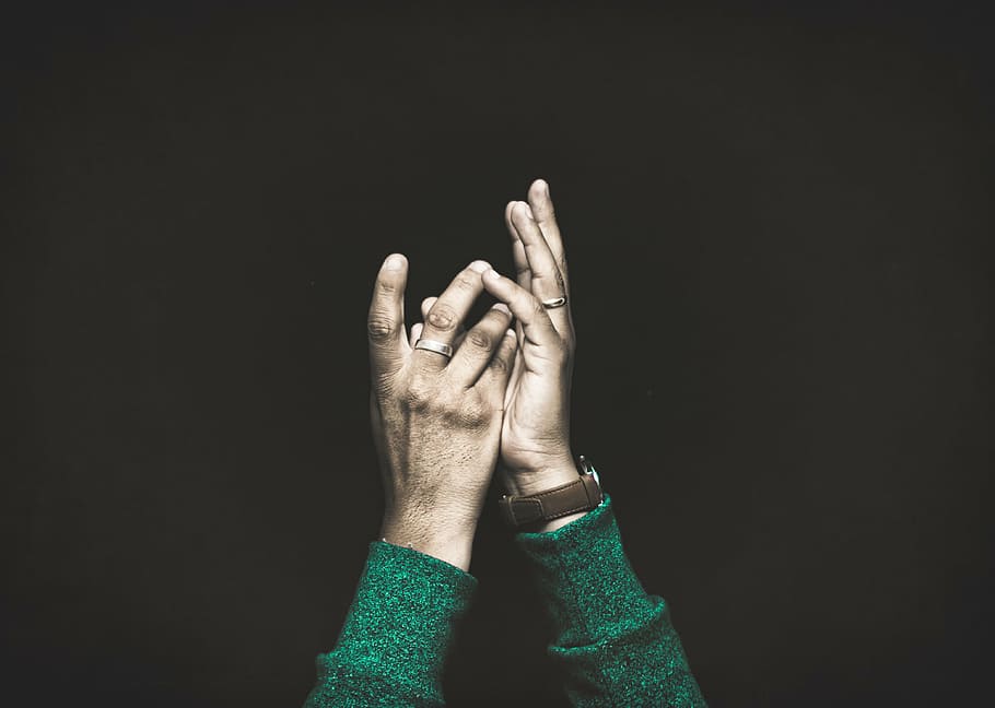 focus photo, raising, hands, person, holding, together, fingers, ring, watch, green