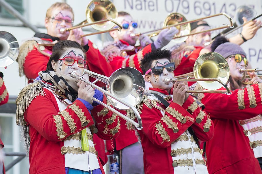 music, carnival, costume, instrument, trombone, glarus, group of people, performance, holding, arts culture and entertainment