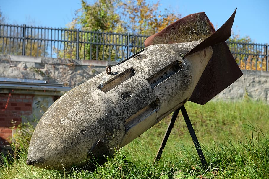 flying bomb, grenade, military, weapon, nature, metal, day, abandoned, plant, grass