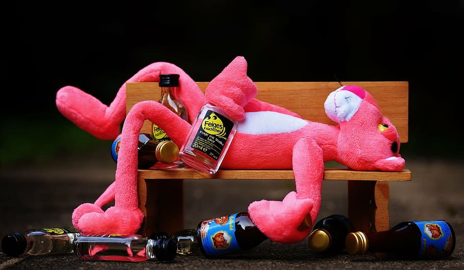pink, panther, plush, toy, laying, brown, wooden, bench, liquor bottles, the pink panther