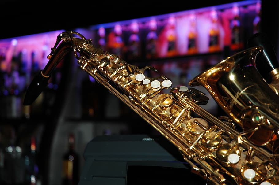 saxophone, musical instruments, brass, music, arts culture and entertainment, musical instrument, indoors, illuminated, focus on foreground, musical equipment