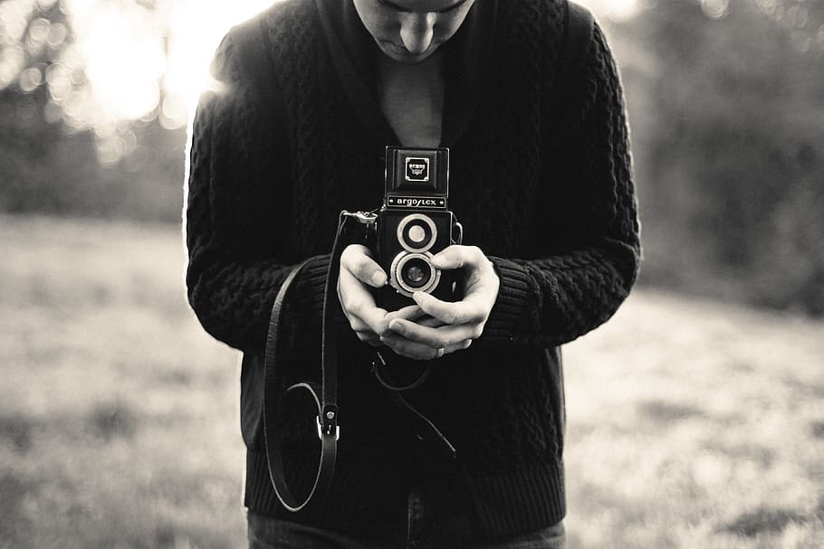black and white, camera, man, argoflex, lens, strap, sweater, people, one person, camera - photographic equipment