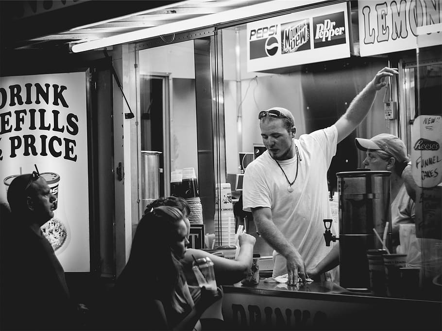 grayscale photo, man, inside, food stall, grayscale, phot, oof, wearing, crew, neck