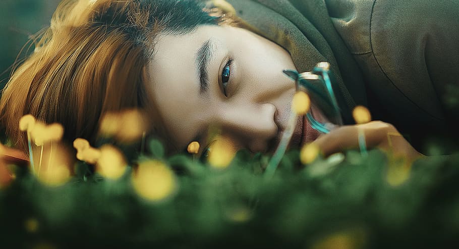 woman, lying, green, grass, person, brown, hoodie, laying, field, people