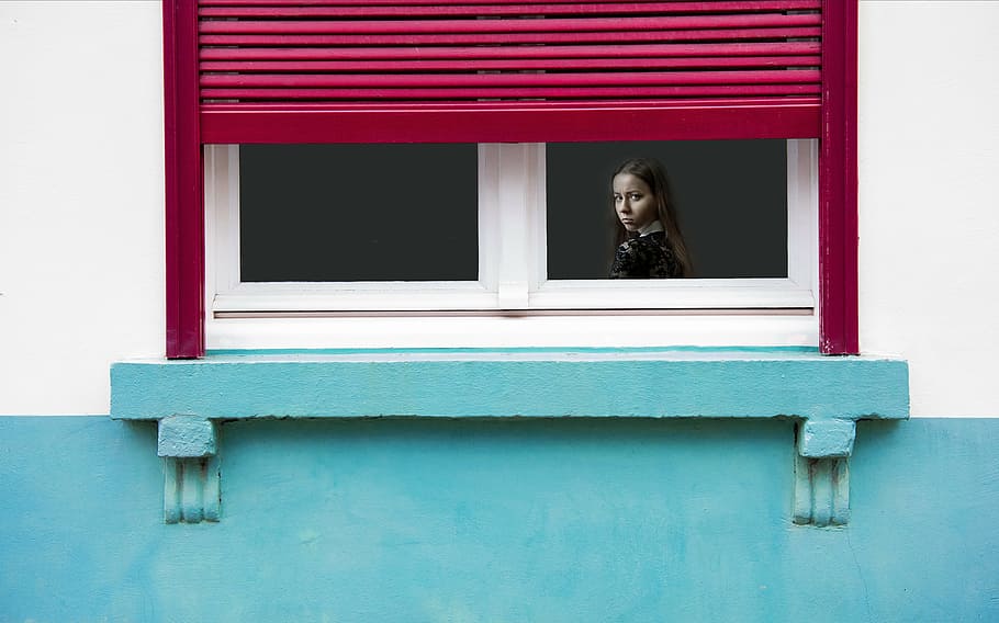 girl, inside, house, looking, window, daytime, annoyed, angry, upset, mad