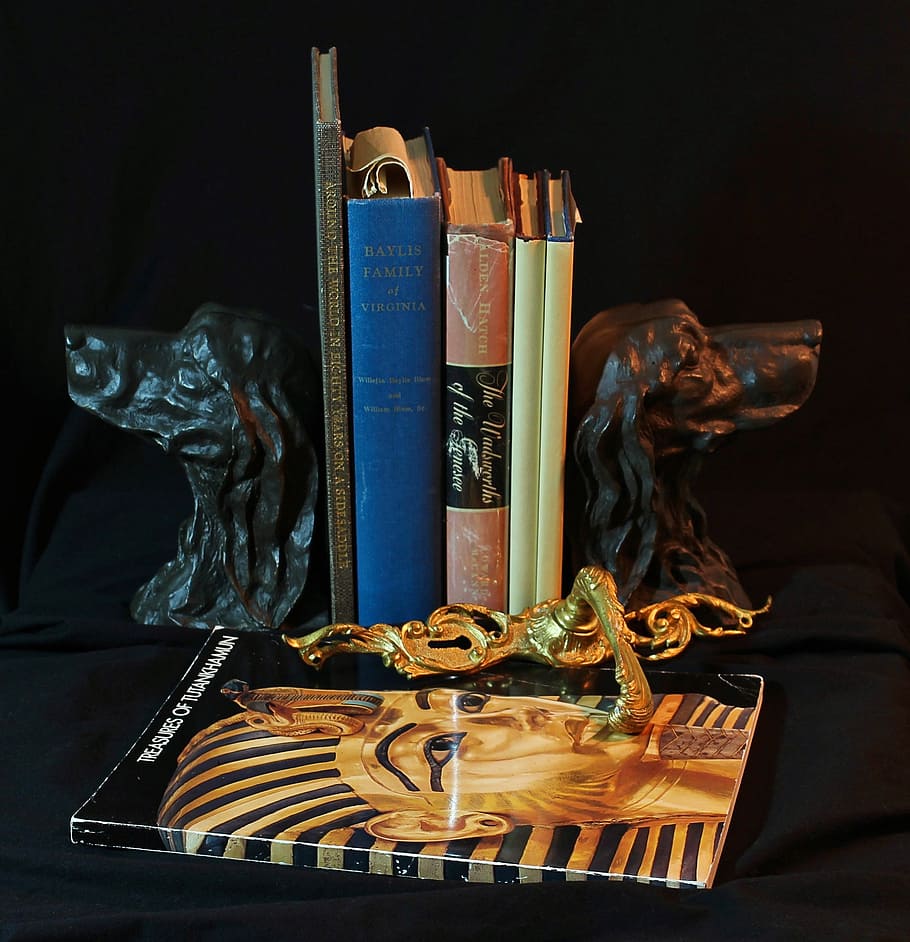 bookends, bronze, dogs, old books, door latch, gilt, king tut, tutankhanun mask, indoors, publication