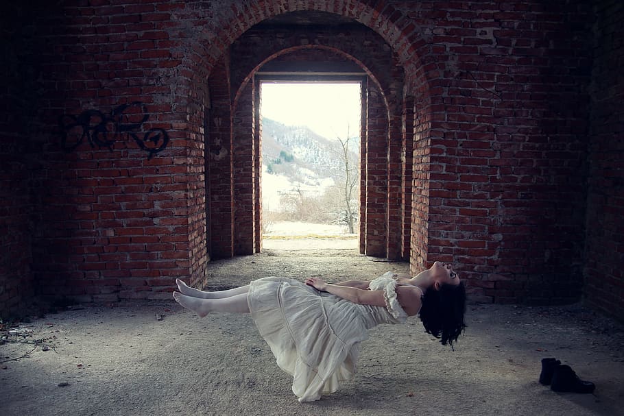 woman, white, dress, floating, inside, red, brick building, daytime, ghost, bride