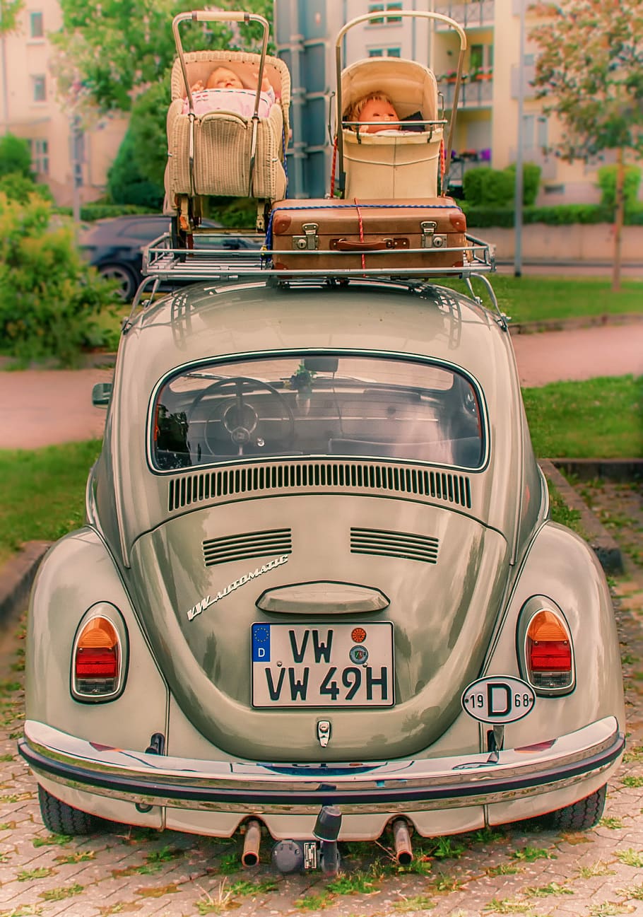 gray, volkswagen beetle coupe, two, beige, doll strollers, roof rack, brown, suitcase, daytime, vw