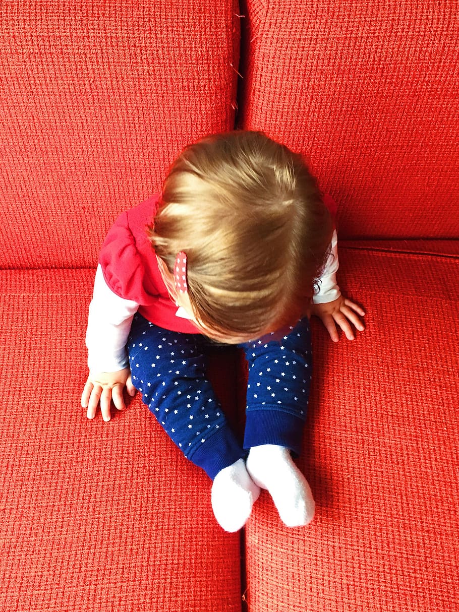 toddler, sits, fabric, sofa, red, childhood, child, high angle view, one person, blond hair