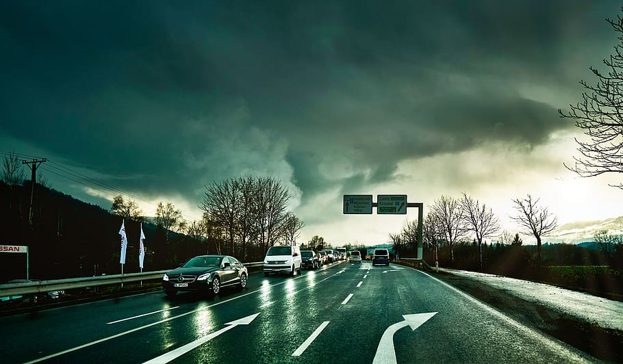 traffic, vehicles, rain, roadway, clouds, light, sun, haze, fog, road marking