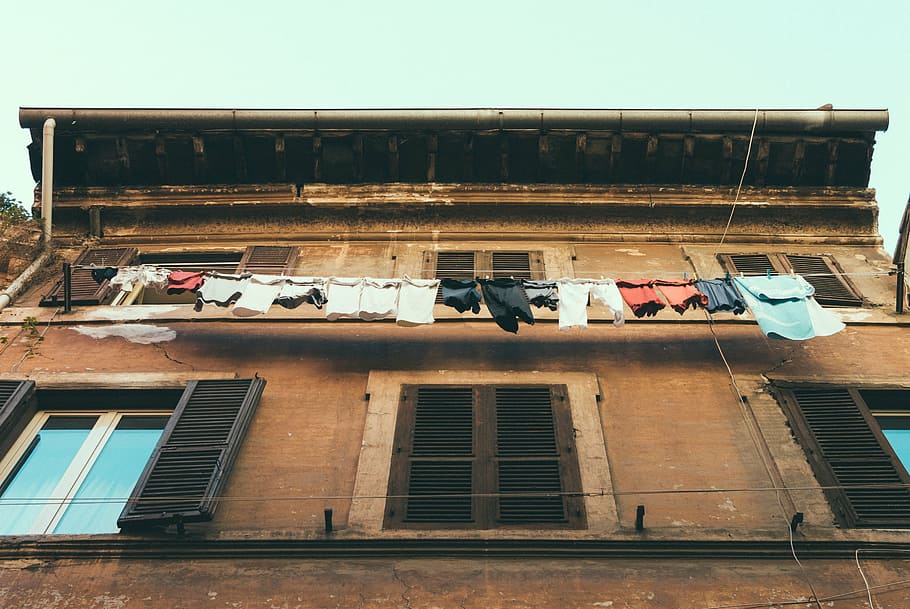 low, angle photography, building, assorted, human, clothes, house, window, laundry, clothing