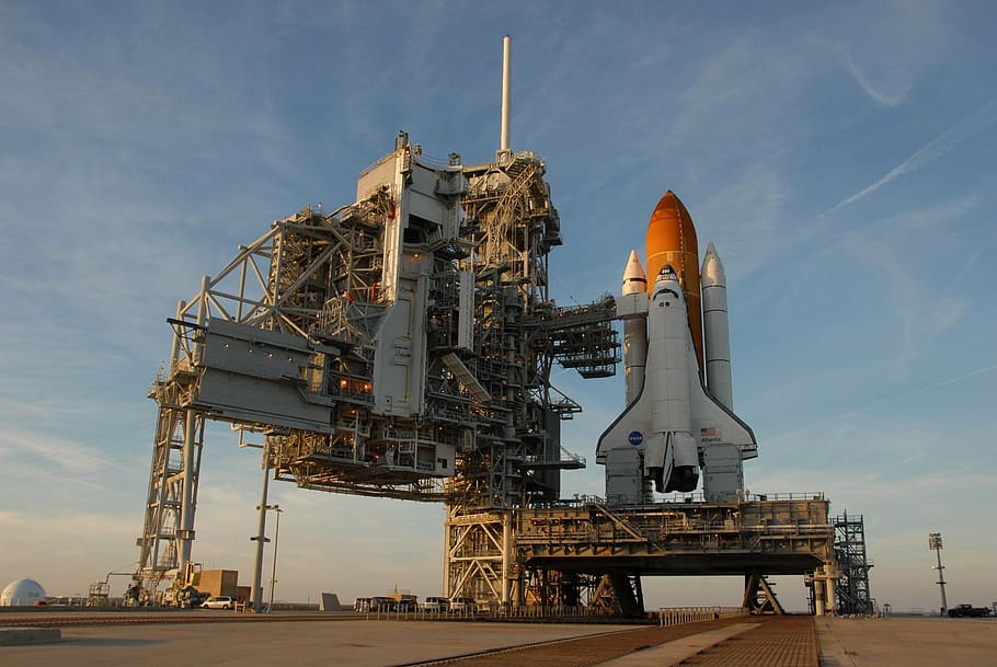 white, orange, spaceship, daytime, atlantis space shuttle, rollout, launch pad, pre-launch, astronaut, mission