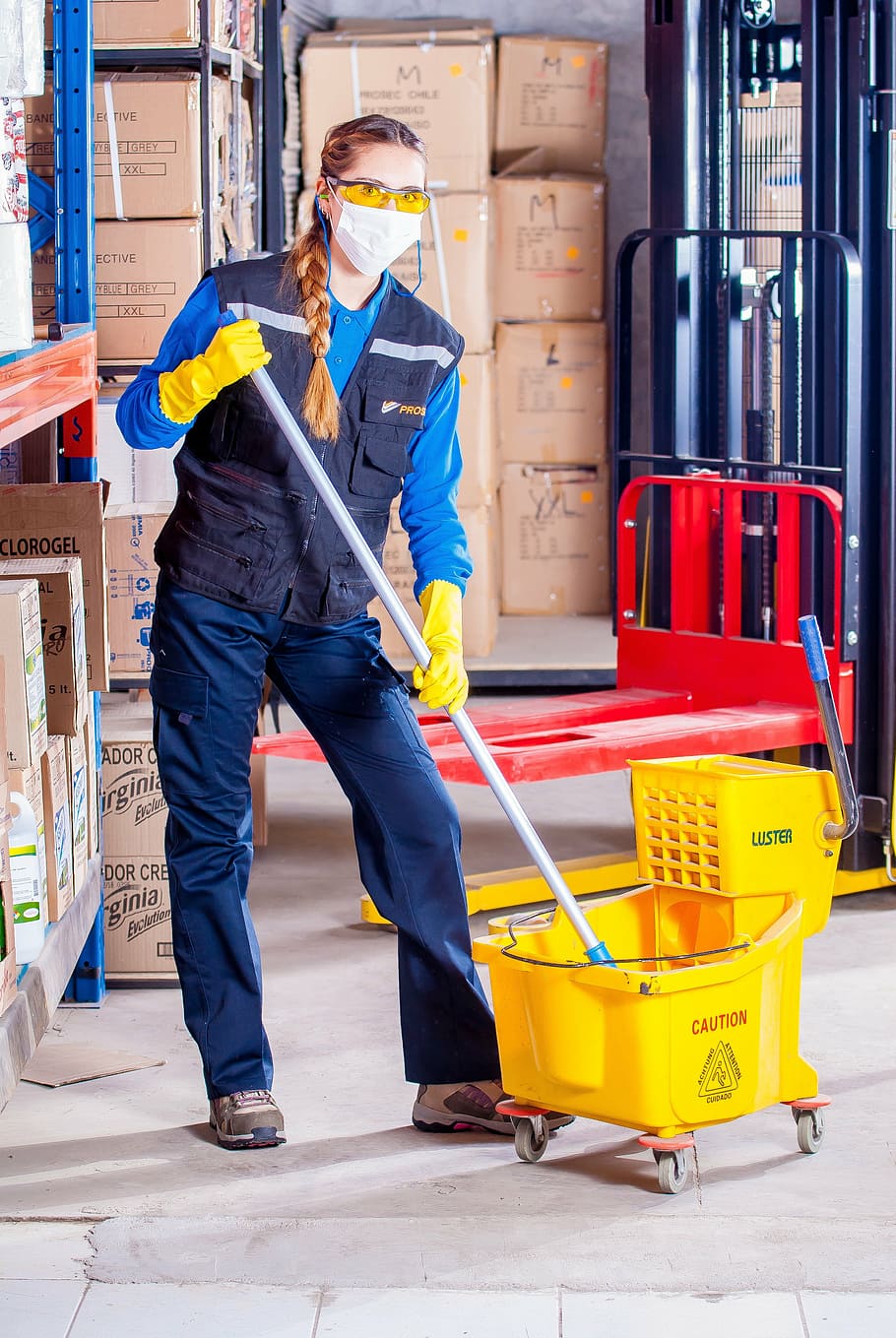 woman holding mop, industrial, security, logistic, work clothes, industrial safety, protective goggles, vest, worker, mandatory