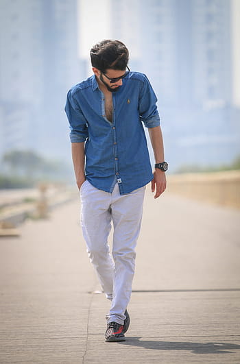 Premium Photo | Fashion and stylish young male poses on broken building  background. handsome man in white shirt.