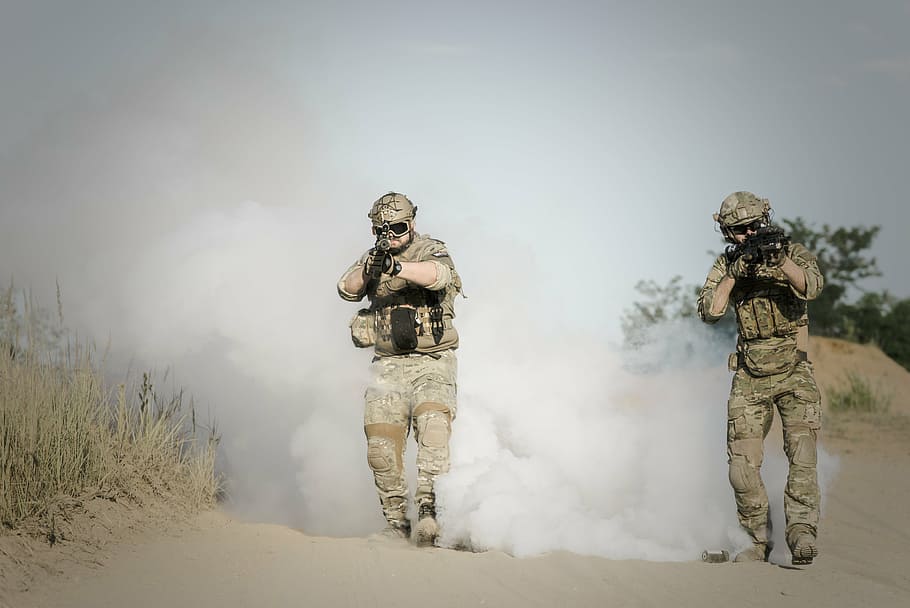 soldier fires rifle, daytime, war, desert, guns, gunshow, soldier, action, smoke, sand