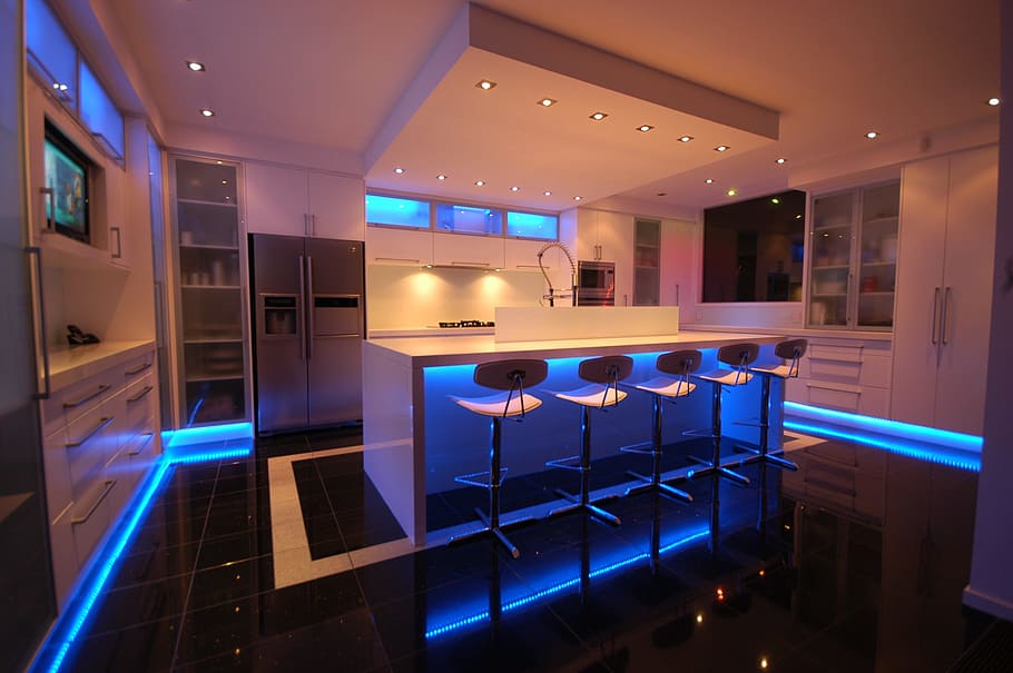 white, wooden, kitchen, blue, led, strips, surrounded, corners, night time, interior
