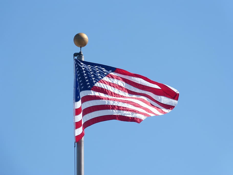 american flag waving, flag, patriotism, american flag, blue, low angle view, sky, striped, wind, nature