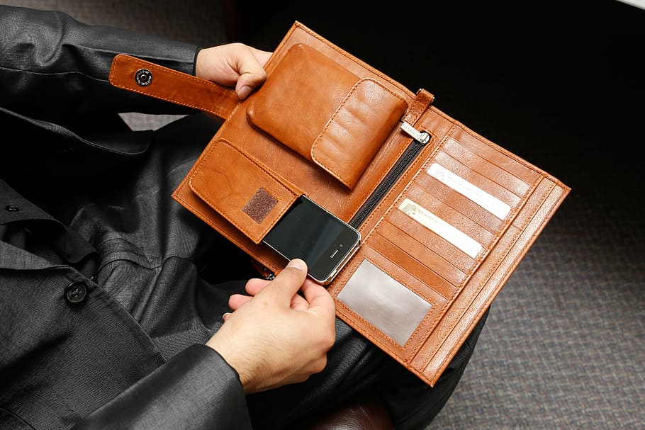 person, holding, brown, leather wallet, smartphone, organizer bag, ashlin, leather, human hand, hand