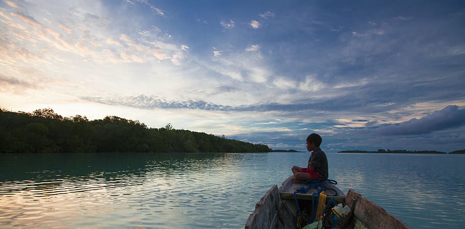 boy, riding, boat, calm, blue, sky, widi islands, twilight, halmahera island, indonesia