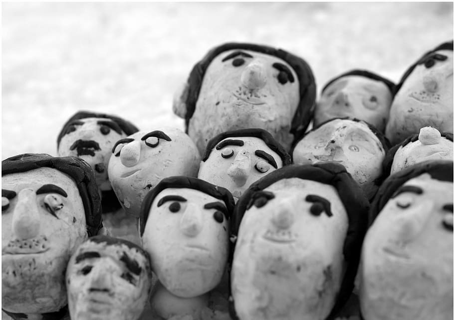 plasticine, clutter, faces, close-up, large group of objects, full frame, selective focus, human representation, abundance, representation