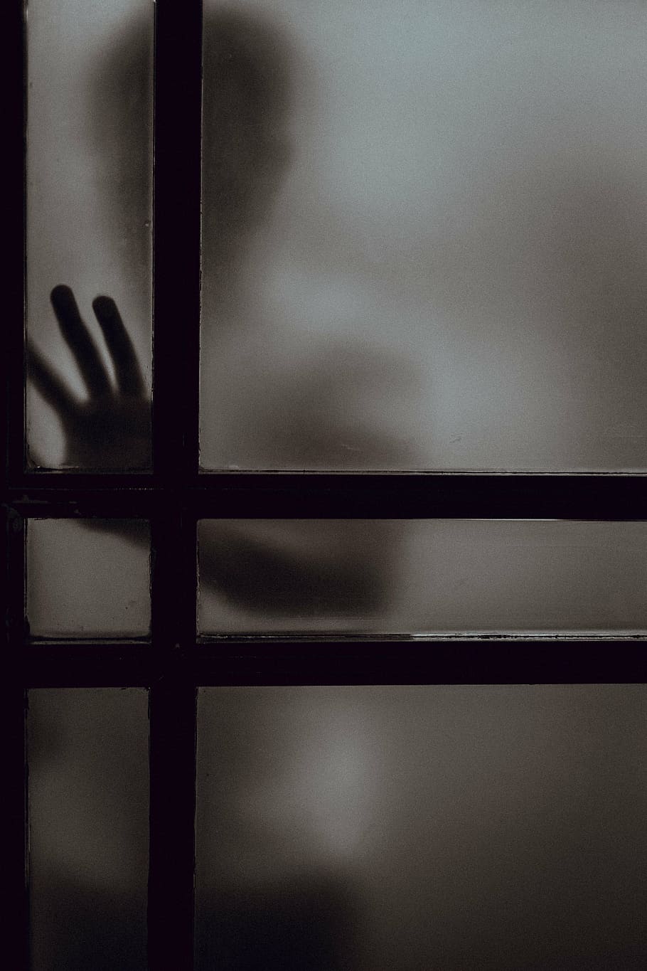 person, placing, hand, frosted, door panel, dark, glass, window, shadow, silhouette