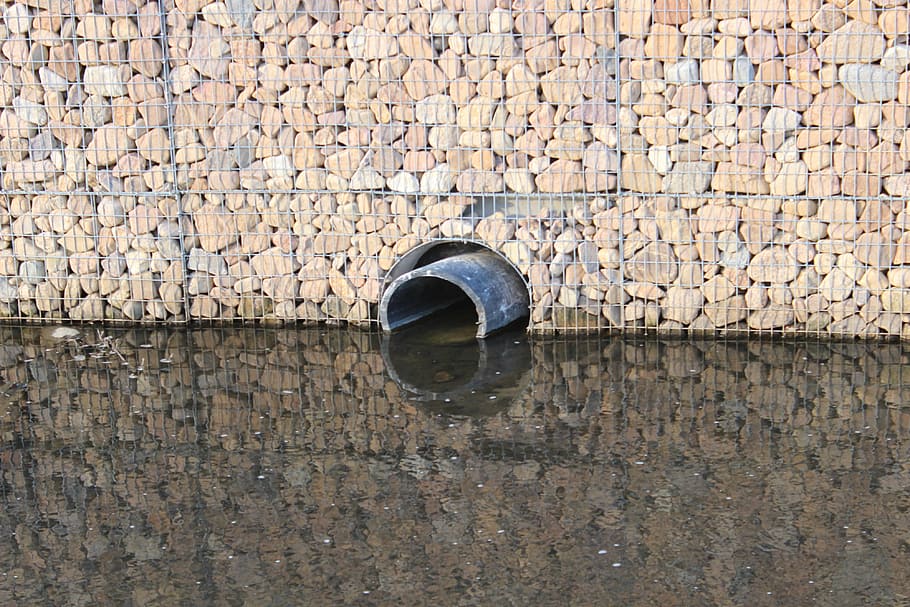 stones, water, tube, drain, mirroring, background, wall - building feature, architecture, day, built structure