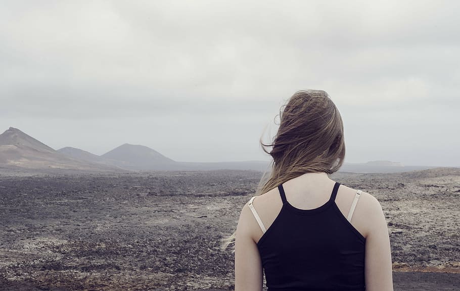 woman, wearing, black, camisole, top, facing, deserted, land, desert, foggy