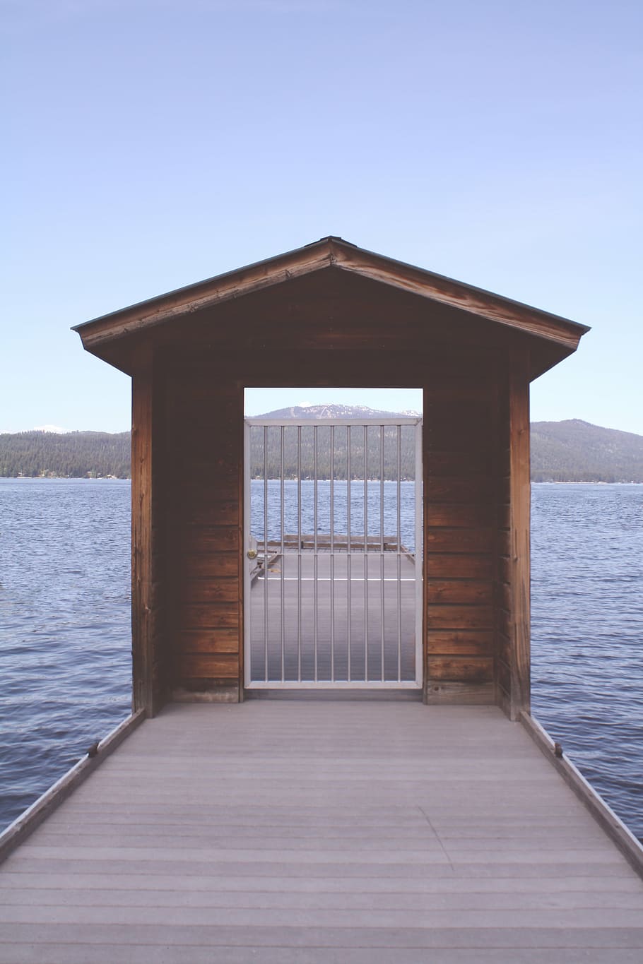 brown, wooden, dock, surrounded, water, white, steel, gate, gray, daytime
