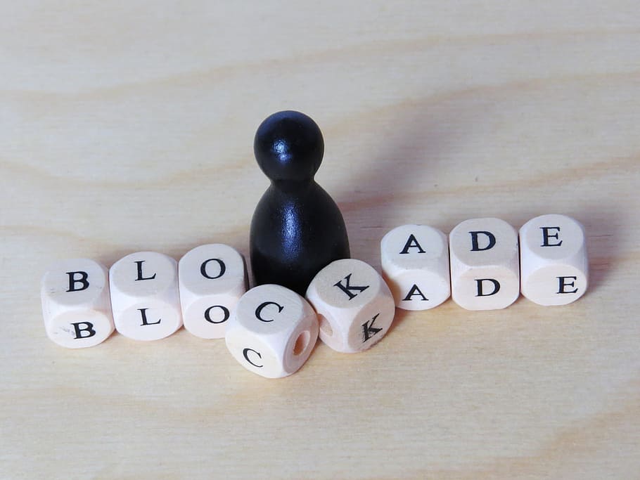 white, blockade game pieces, family, family posing, blockade, obstacle, psychotherapy, text, indoors, western script