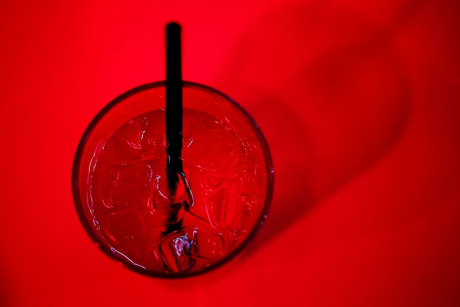 glass, ice cubes, ice, drinks, straw, red, red background, close-up, indoors, studio shot