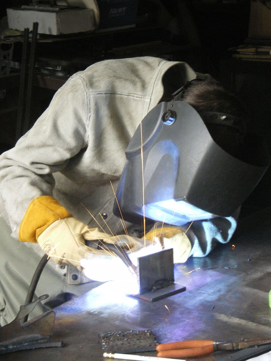 person welding, metal, welding, blue-collar, trades, industry, worker, steel, manufacturing, iron