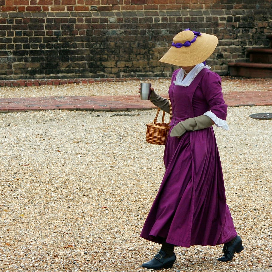 woman, walking, holding, basket, cup, wall, costume, reenactor, 18th century dress, female clothing