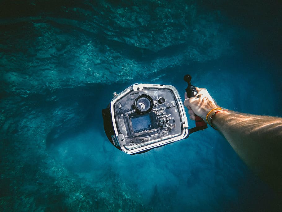 person, holding, water camera, people, man, travel, adventure, underwater, ocean, sea