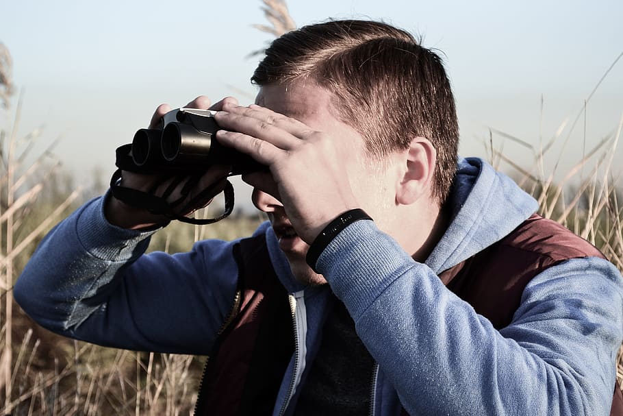 man, gray, hoodie, using, binoculars, binocular, spying, looking forward, male, person