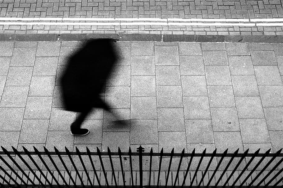 person, walking, sidewalk, wearing, black, pants, gray, concrete, floor, pedestrian