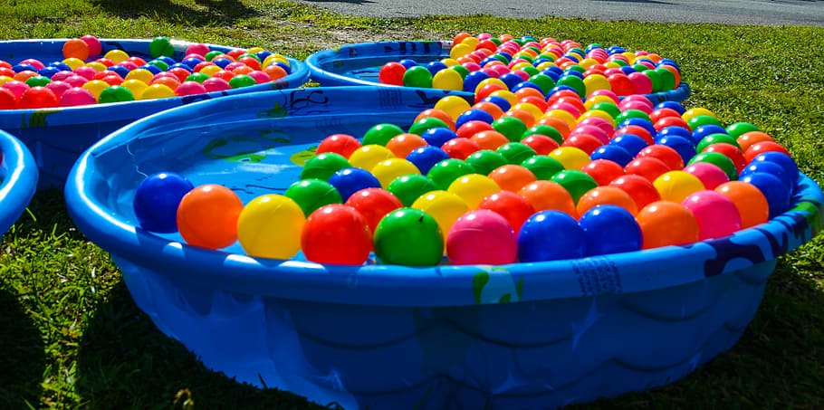 pool, balls, childhood, happiness, play, multi colored, large group of objects, grass, nature, fun