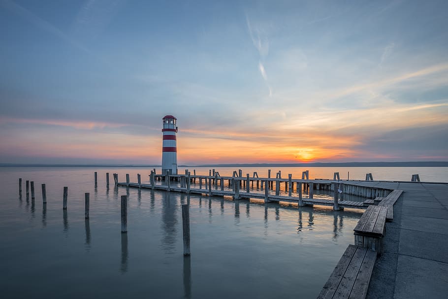pier, dock, ocean, sea, water, sunset, dusk, lighthouse, sky, clouds