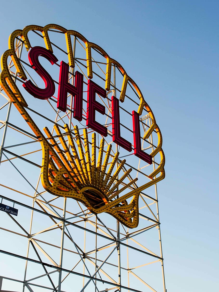 shell billboard, yellow, red, shell, billboard, signage, daytime, gas, company, steel