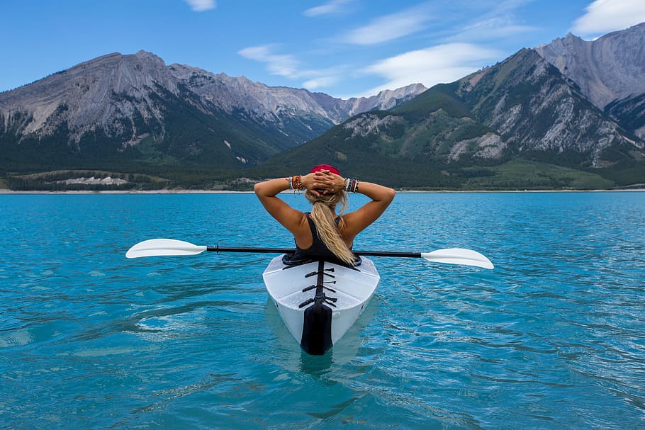 woman, white, kayak, paddle, water mountain, distance, daytime, woman in white, water, mountain