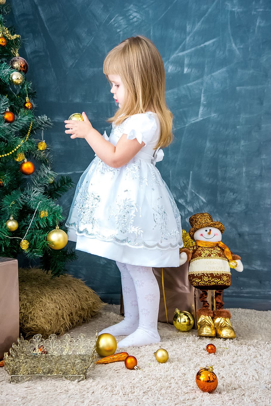 girl, white, light-blue, dress, holding, gold-colored christmas bauble, new year's eve, christmas background, holiday, girl decorates the christmas tree