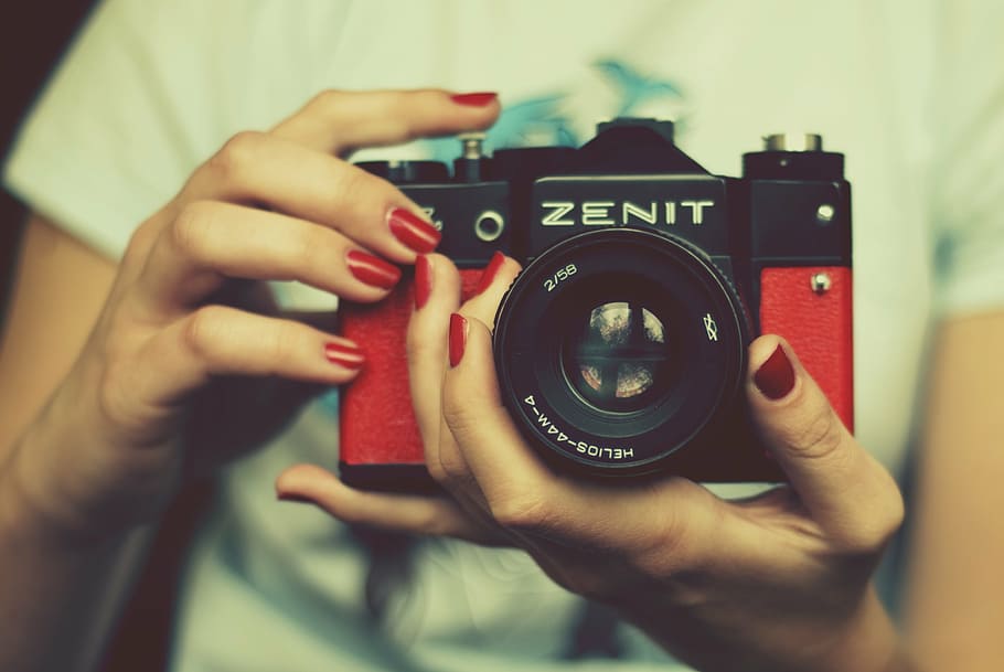 person, holding, red, black, zenit slr camera, camera, zenith, lens, retro camera, the historic camera