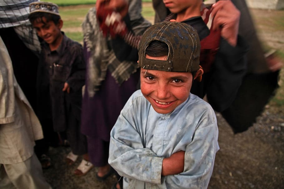 boy, wearing, blue, long-sleeved, top, afghani, child, laughing, poor, dirty