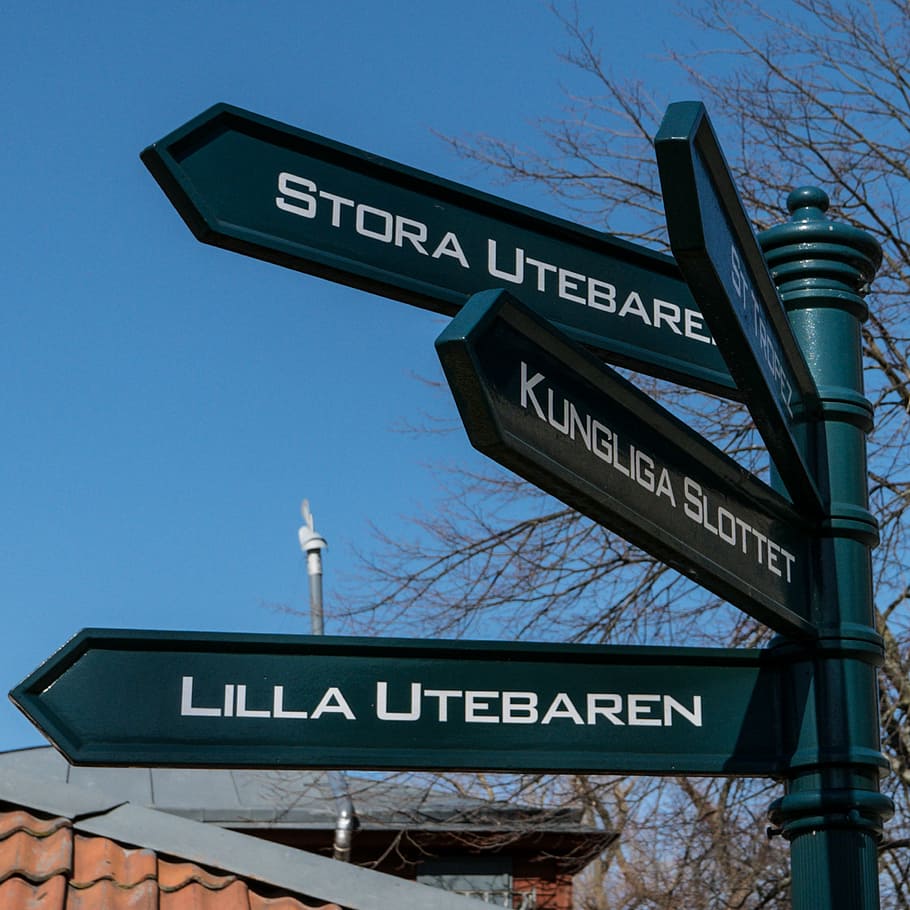 stockholm, sign, directions, destination, direction, road Sign, text, western script, communication, architecture
