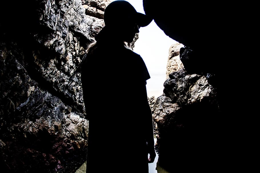 silhouette photography, person, inside, cave, daytime, silhouette, rock, dark, stone, adventure