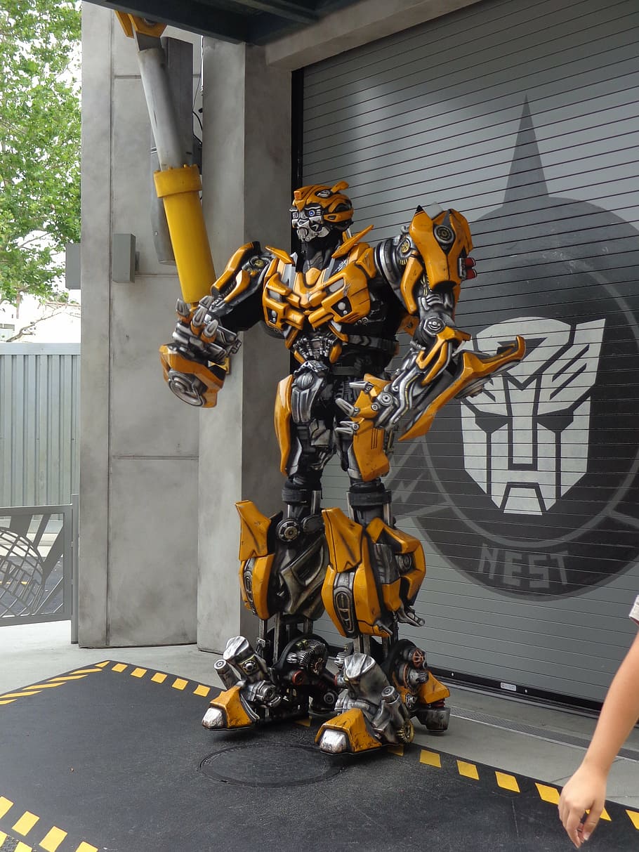 transformers bumblebee statue, front, gray, roller shutter, robot, robotics, machine, futuristic, science, gear
