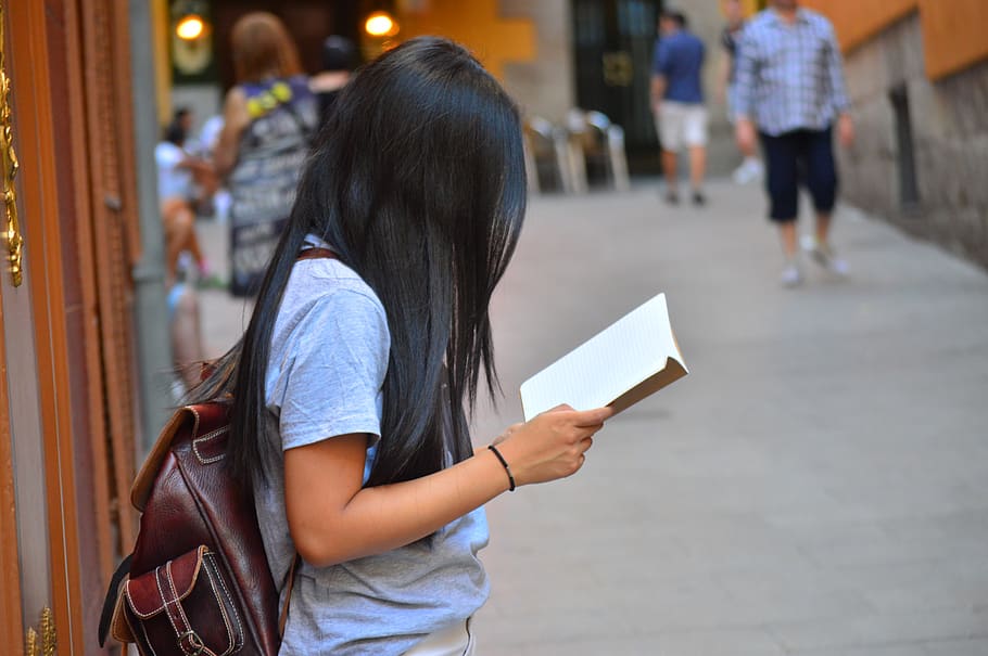 woman, book, street, reading, spain, madrid, women, casual clothing, lifestyles, real people